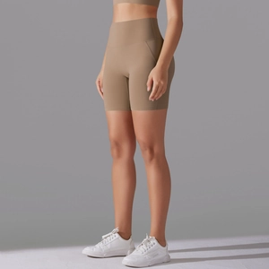 Side view of high-waist seamless khaki yoga shorts showing stretch fabric and fit