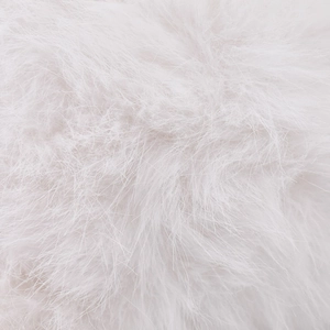 Macro shot showing the soft white plush rabbit fur texture and fiber detail on the baseball cap