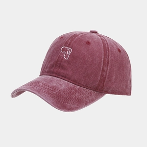 Close-up of retro washed dark red baseball cap with cute dog embroidery detail