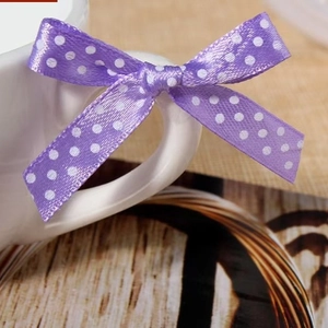 Purple satin ribbon bow with white polka dots for gift boxes and DIY wedding decoration