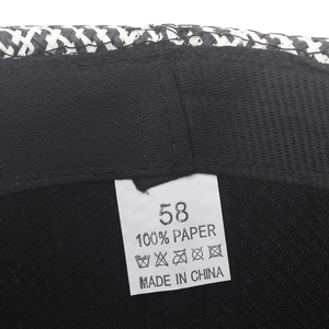 Detail of internal sweatband and size 58 label on breathable straw jazz hat