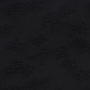 Détail macro du tissu noir de haute qualité avec une élégante texture jacquard florale