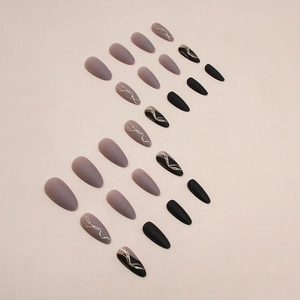 Elegant matte grey and black press-on nails with golden marble texture and water-drop shape