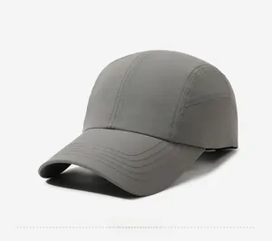 Side view detail of a quick-dry dark grey sports baseball cap with fine fabric texture