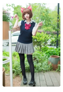 Cosplay set featuring navy knit vest, pleated skirt, and cute pink furry cat ears