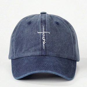 Navy blue washed cotton baseball cap with white faith cross embroidery on a plain background