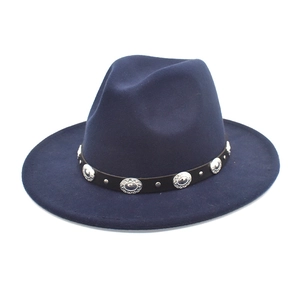 Detail of navy blue wool fedora featuring a black leather band with silver metal studs