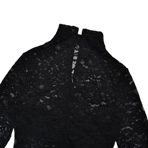 Detailed close-up of high-collar black lace jumpsuit with hollow back and invisible zipper