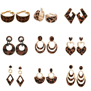 Set of 9 vintage leopard print earrings in geometric and heart shapes with gold metal