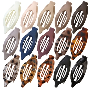 Set of 15 oval hollow hair clips in diverse matte and glossy colors for women