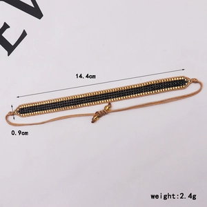 Detail view of handmade gold and black Miyuki bead bracelet with dimensions 14.4x0.9cm