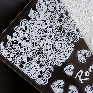 Exquisite white lace nail stickers with floral and heart patterns for DIY manicure