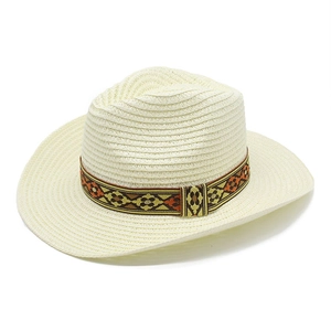 Ivory woven straw western cowboy hat with ethnic geometric band on white background
