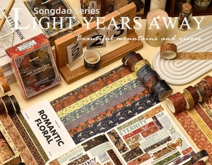 Macro detail of 12-roll vintage washi tape set featuring traditional Chinese landscape art