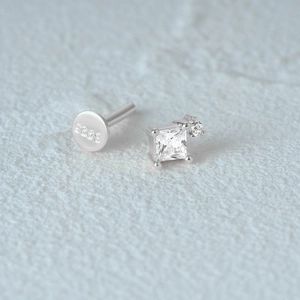 Macro shot of S925 sterling silver flat back stud with square and round cubic zirconia