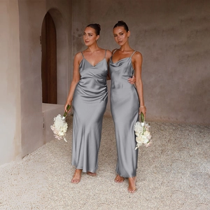Close-up of sleek grey satin dress showing fine fabric texture and elegant pleated V-neckline