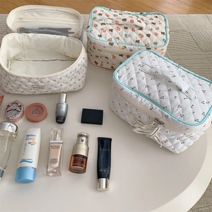 Internal view showing breathable mesh pockets in quilted cotton makeup bags set