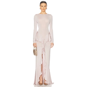 Detail view of light pink long sleeve dress featuring ruffle hem and elegant front slit