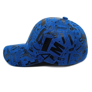 Close-up of street style baseball cap featuring navy blue fabric with black graffiti print