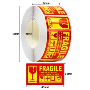 Detailed view of 250 red fragile stickers roll with Handle with Care warning text