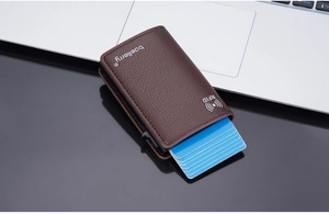 Detail of RFID blocking brown lychee leather card holder with pop-up aluminum wallet case