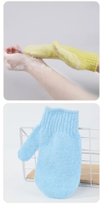 Close-up of exfoliating bath gloves in blue and yellow showing foamy skin cleaning detail