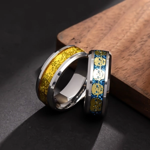 Punk style stainless steel skeleton rings set with gold skull inlay and blue glitter