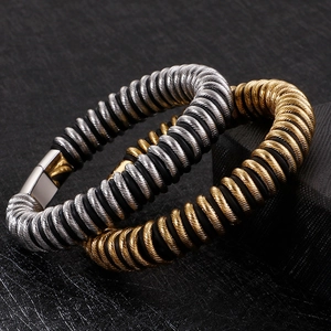 Detail of masculine braided steel cables with polished square metal magnetic clasps
