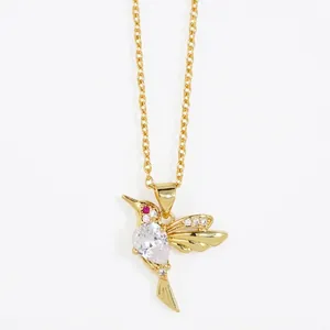 Gold hummingbird pendant necklace with teardrop cubic zirconia and red stone eyes