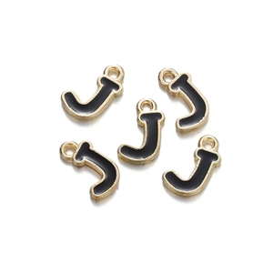 Macro detail of five gold-plated alloy letter J charms with black enamel filling and hooks