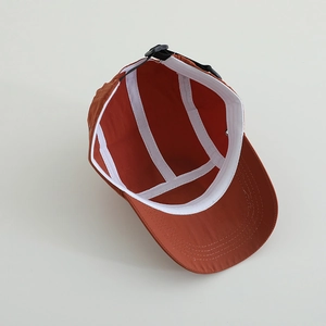 Kids quick-dry camper hat in caramel orange with breathable lining and adjustable strap