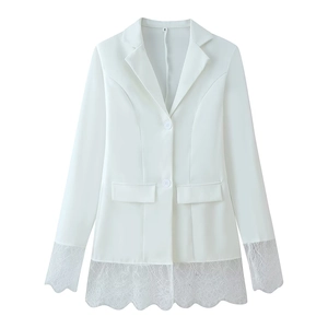Detail of white blazer showing delicate lace拼接 at the cuffs and hem with buttons