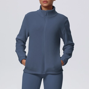 Detail of high neck fleece running jacket with full zipper and side pockets in blue