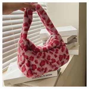 Detailed view of pink plush heart tote bag with soft faux fur and white zipper