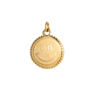 Macro shot of a gold-plated smiley face pendant with gear-edge design for jewelry DIY