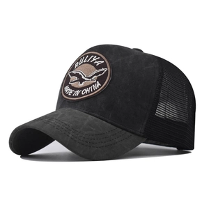 Detail of grey vintage baseball cap with mesh back and embroidered bird patch logo