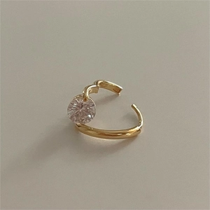 Macro shot of 925 sterling silver stamp on minimalist gold ring with zircon stone