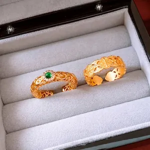 Vintage style 24k gold-plated rings with green gemstone and floral cutout patterns