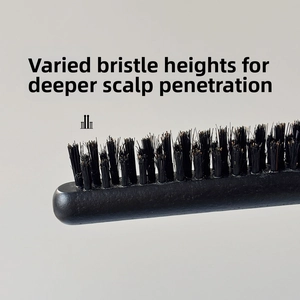 Detail view of multi-level bristles on a professional hair brush for scalp massage