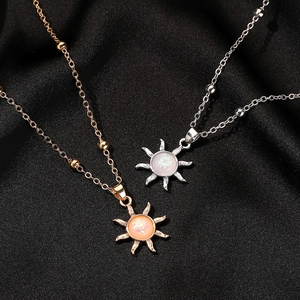 Elegant opal sun pendant necklaces in gold and silver finish on premium black silk backdrop