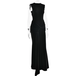 Detailed view of the elegant pleated waist and flowing ribbon on this black maxi dress