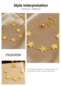 Detail of gold-plated five-petal flower charms on adjustable link bracelet