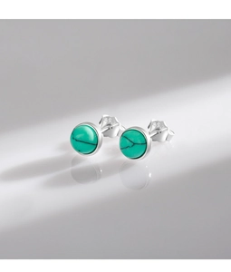 Detailed close-up of S925 sterling silver turquoise stud earrings with authentic hallmark