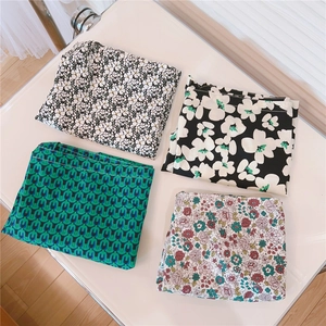 Detailed grid view showing four diverse floral and geometric print cotton shoulder bags