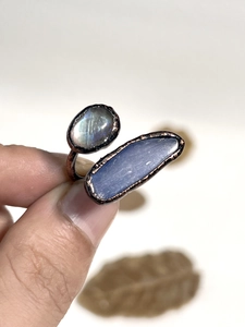 Detail view of handmade copper ring with natural labradorite and blue crystal stones
