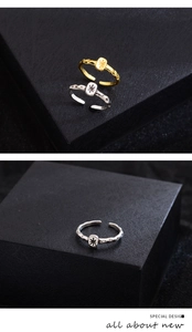 Detail of lava texture adjustable ring featuring an engraved starburst metal square