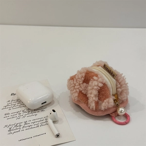 Close-up of pink waffle fleece earphone case with pearl pendant and zip closure