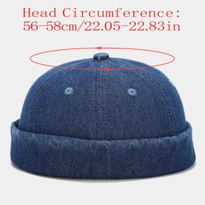 Detail of blue denim docker cap with embroidered eyelets and 56-58cm head circumference