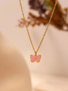 Detailed close-up of a golden chain with a delicate pink butterfly pendant for girls