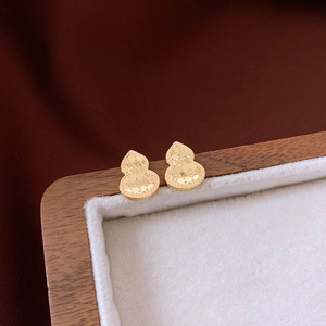 Golden gourd-shaped stud earrings with textured diamond-cut finish in a classic style